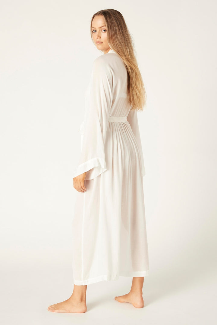 Profile of Studio model in natural bamboo kimono, highlighting fluid fabric and wide sleeve design.