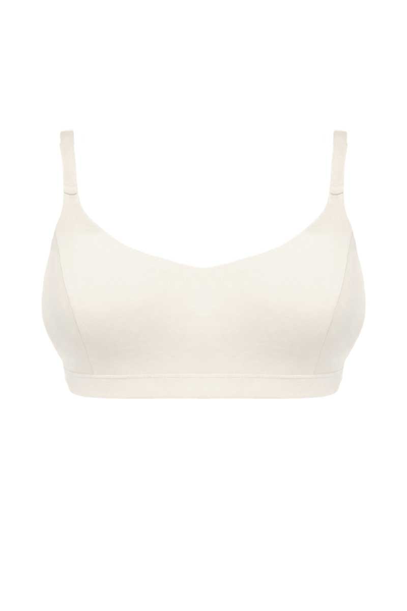 An off-white wireless bra with thin shoulder straps, shown against a plain white background.