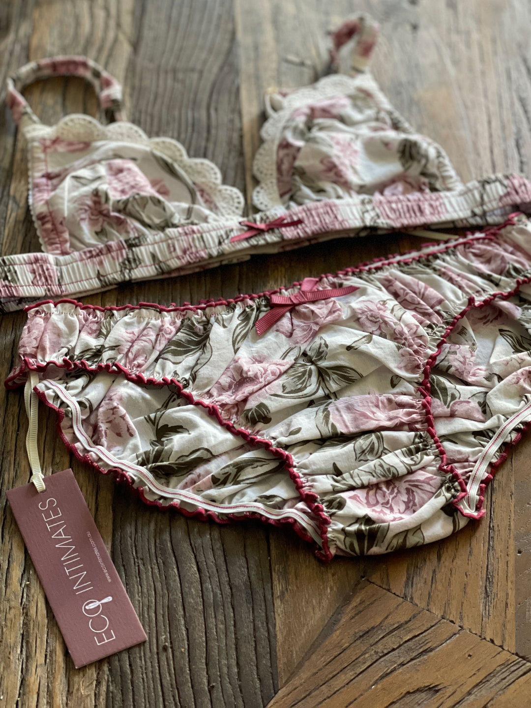 flatlay of organic cotton lingerie in bloom print on wooden background