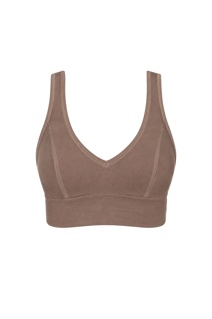 A SOFT BROWN, full cup crop bra made from organic cotton, with a v-neckline and wide straps.
