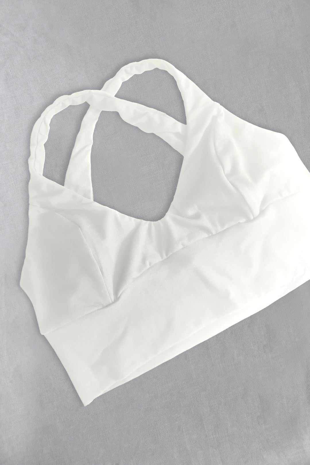 White cotton bra on a gray background
