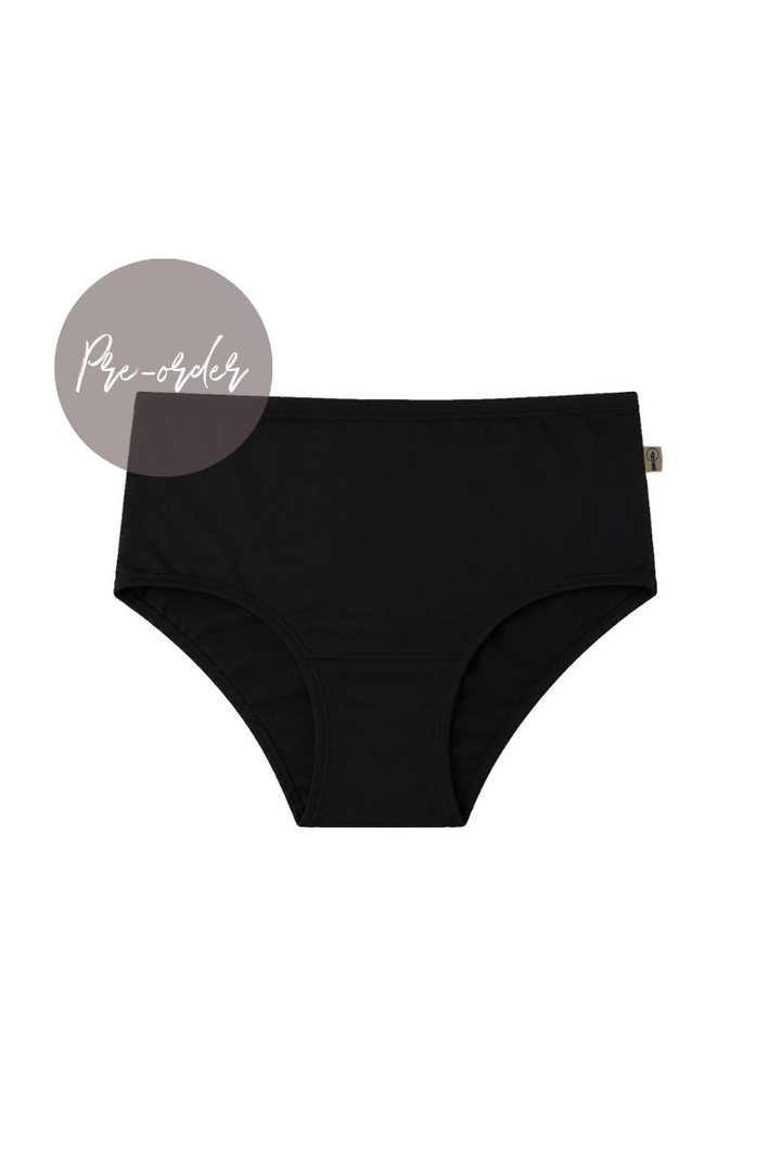 Black mid-rise briefs shown flat against a white background, with a small taupe circular label reading 'pre-order' in the upper left and a tiny side tag visible on the right.