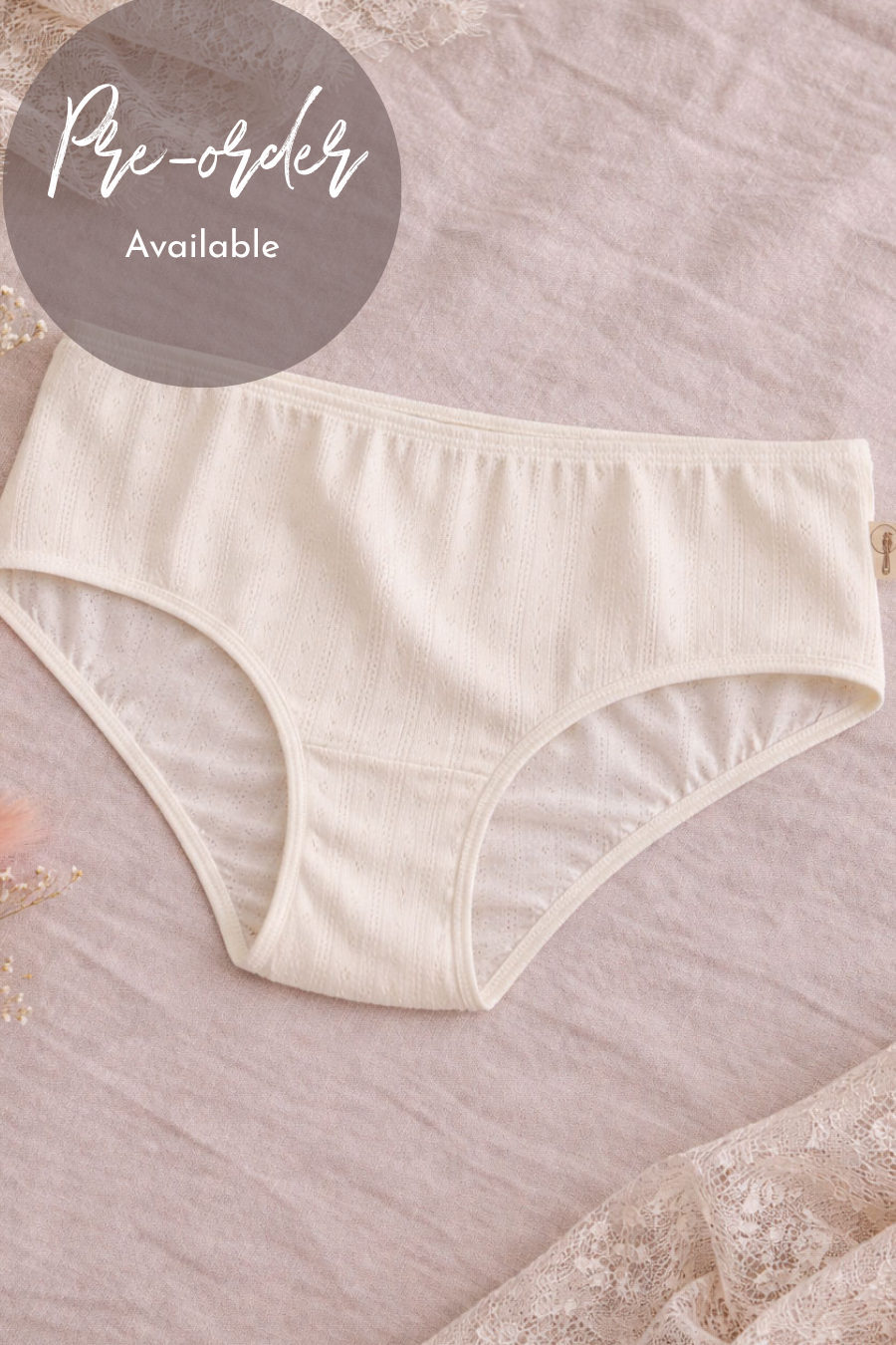 Beige women's underwear on a soft pink background with 'Pre-order Available' text.