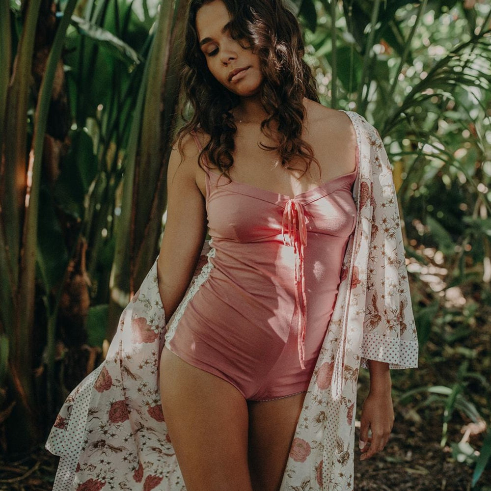 model wearing organic cotton lounge wear in pink and chinoiserie floral