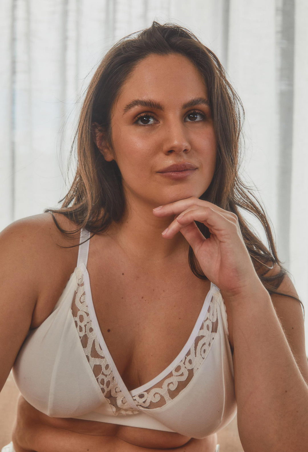 model wearing full cup bralette in natural colour with lace trim