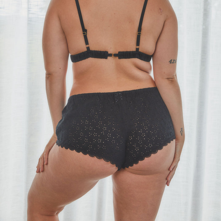 model showing back view of broderie anglaise french knickers in black