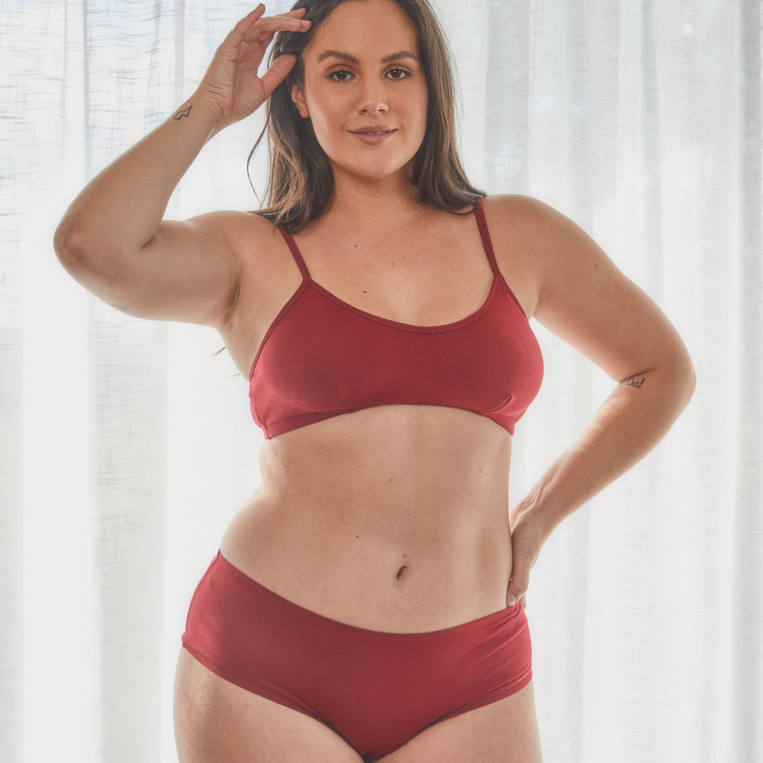 model wearing boyleg style organic cotton underwear in garnet red