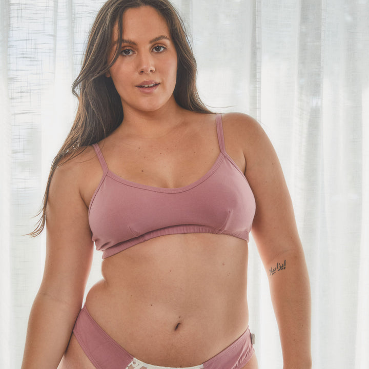 model showing front of organic cotton soft cup bralette in dusty rose